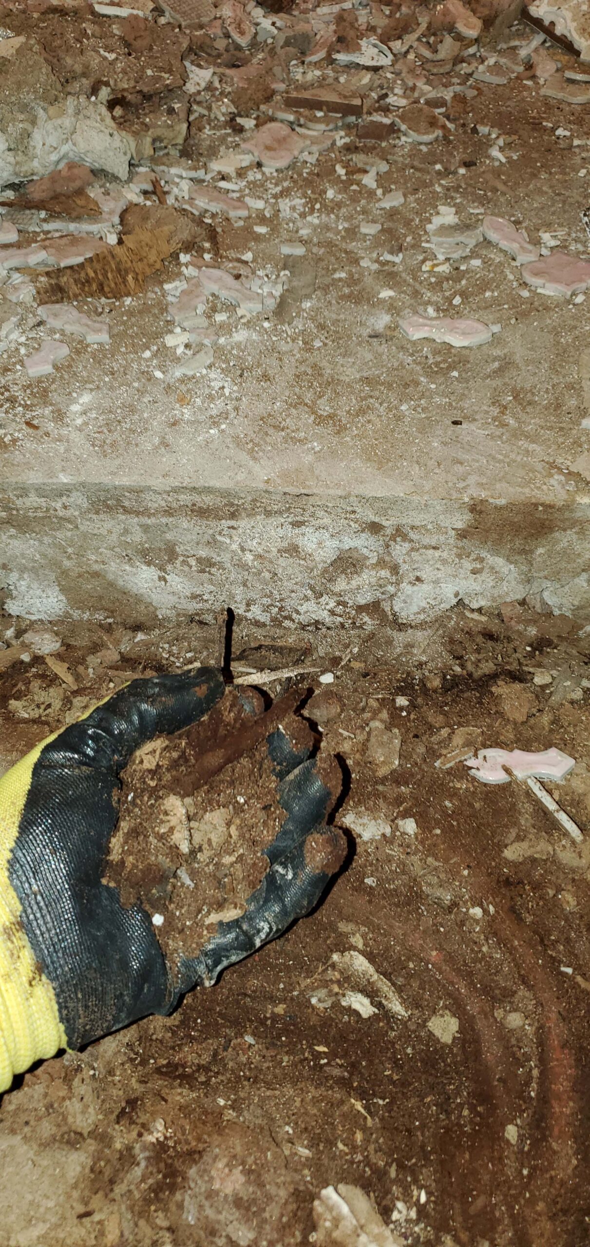 dirt and water damage under the floor
